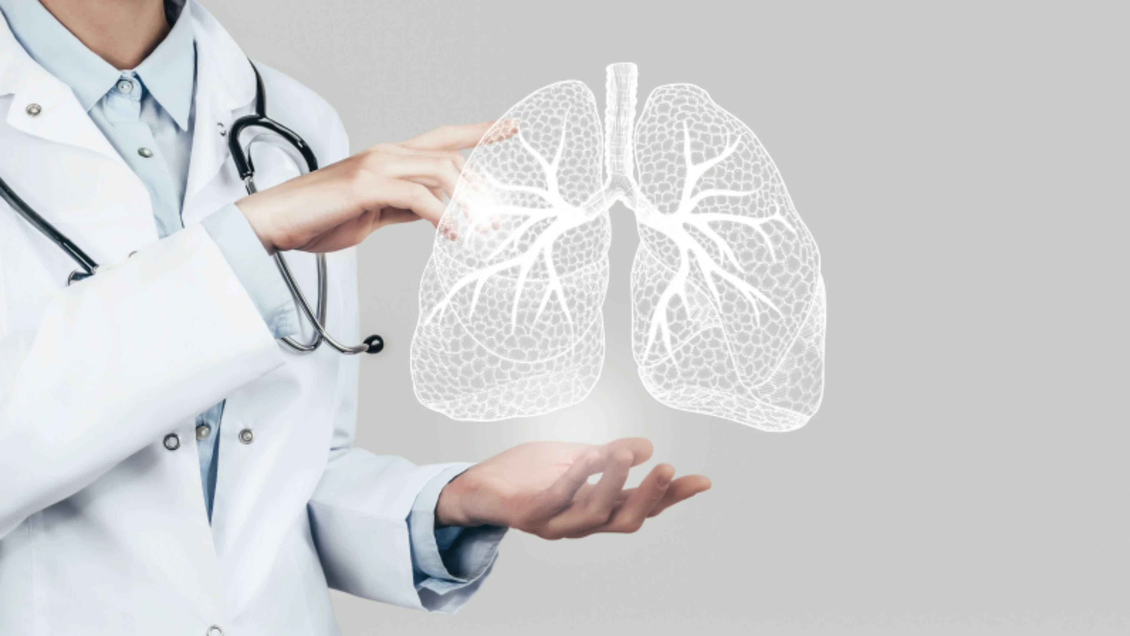 A doctor holding a lungs hologram