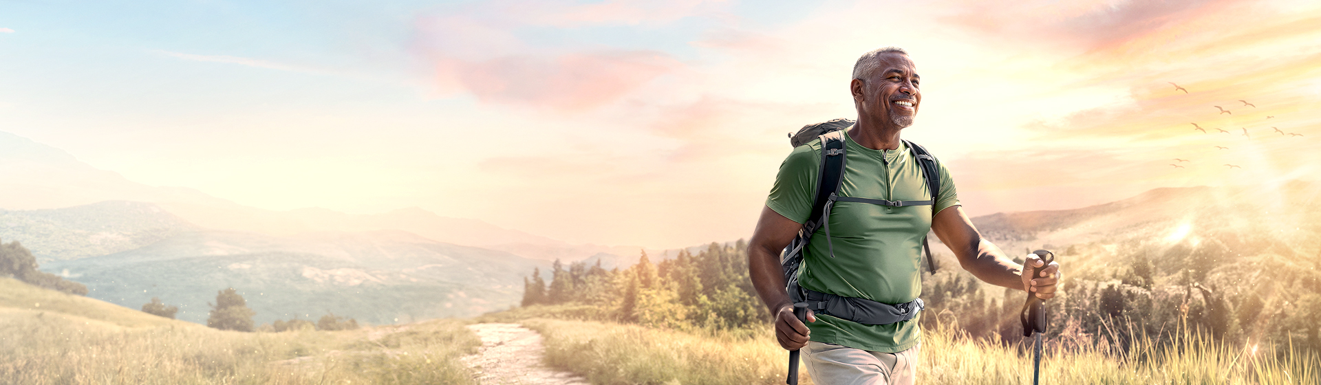An elderly man hiking with a smile