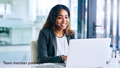 Portrayal of an woman in an office speaking into a headset