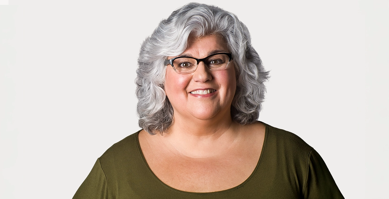 Woman with immune thrombocytopenia (ITP) smiles.
