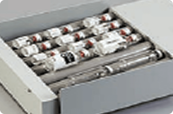 Image of an open storage containing multiple medicine vials.