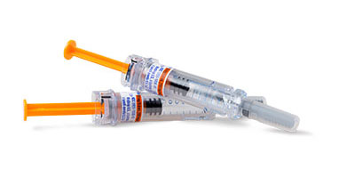 Two medical syringes with orange plungers and labeled text on them.