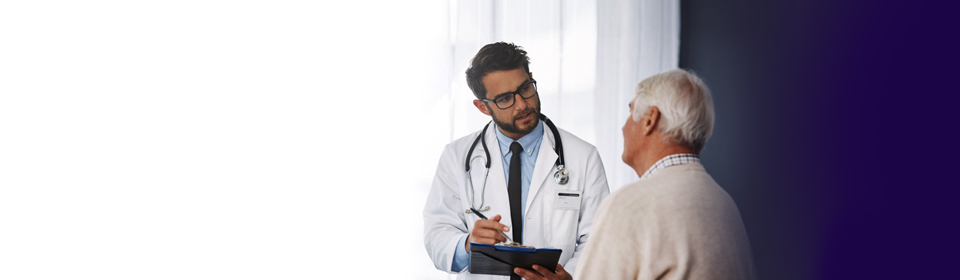 Doctor consulting a senior male patient