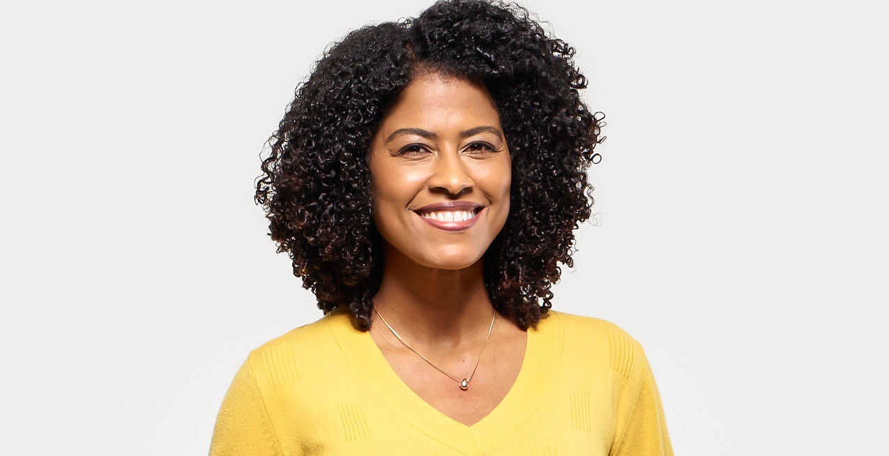 Woman with immune thrombocytopenia (ITP) smiles.