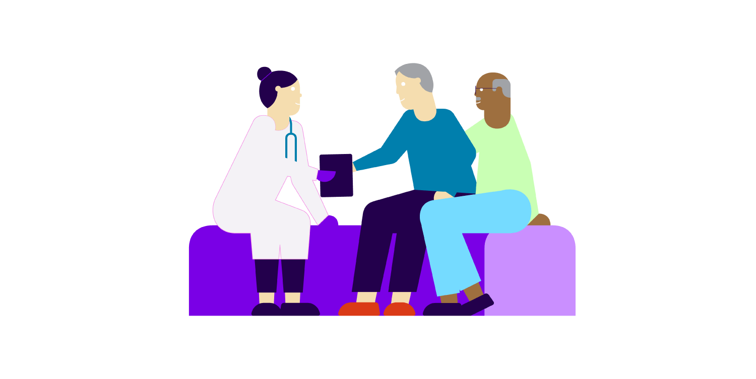 Un médecin qui tient le bras d’un patient accompagné de sa femme