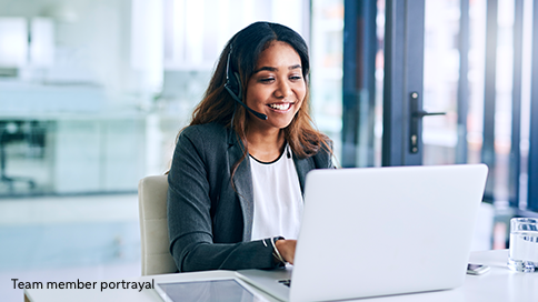 Portrayal of an woman in an office speaking into a headset